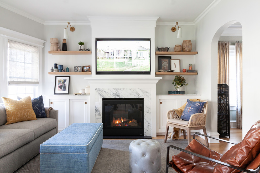 Transitional enclosed light wood floor and brown floor living room photo in New York with a standard fireplace, a stone fireplace and a media wall