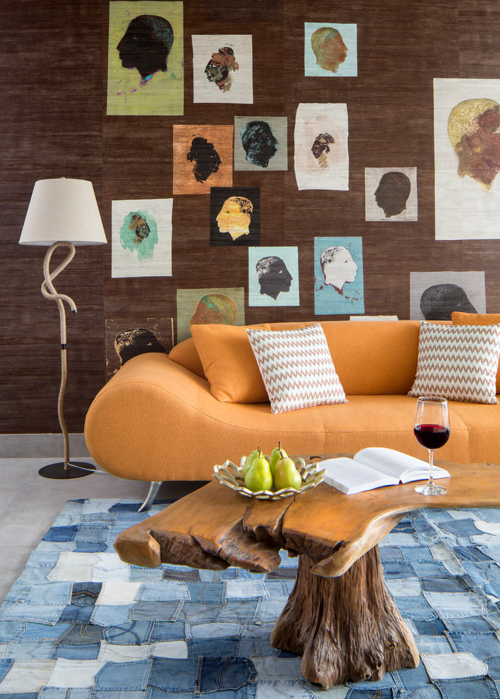 Example of a trendy concrete floor living room design in Miami with brown walls