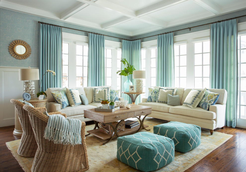 Cette photo montre un grand salon chic ouvert avec un mur bleu, parquet clair, une cheminée standard, un manteau de cheminée en bois, un téléviseur encastré, un sol marron, un plafond à caissons et du papier peint.