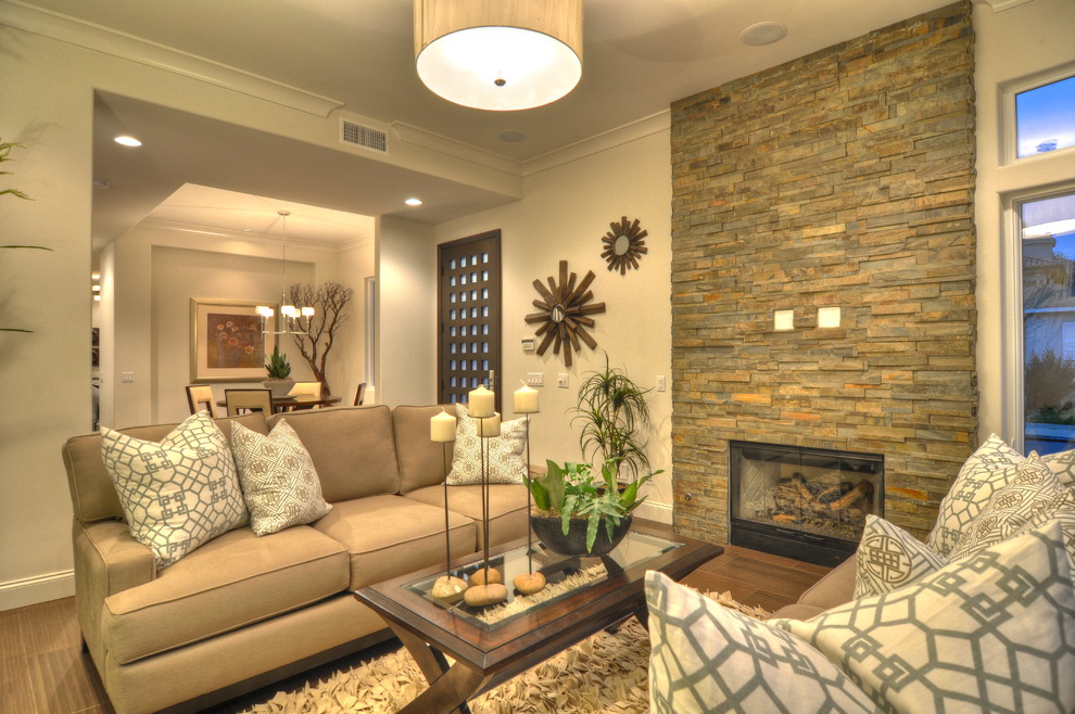 This is an example of a contemporary living room in Orange County with white walls.