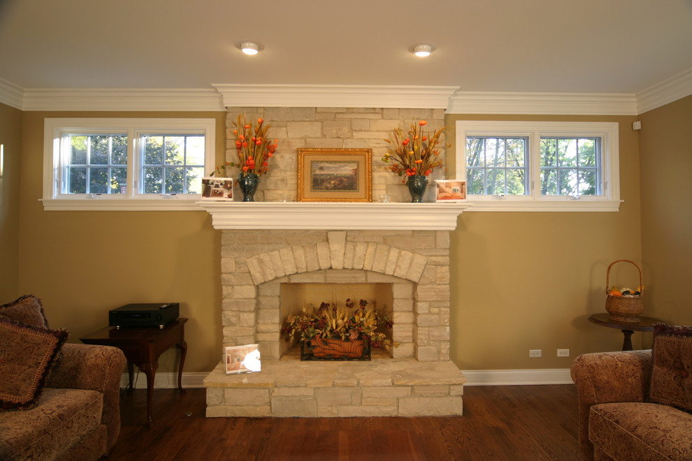 Photo of a medium sized classic formal open plan living room in Chicago with beige walls, a standard fireplace and a stone fireplace surround.