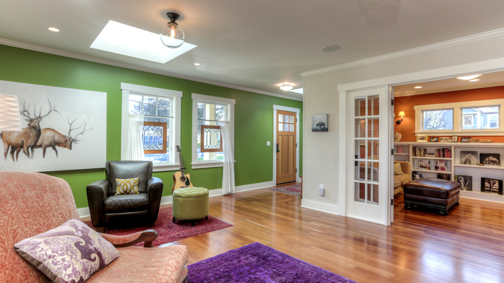 Medium sized classic open plan living room in Other with a reading nook, green walls and medium hardwood flooring.