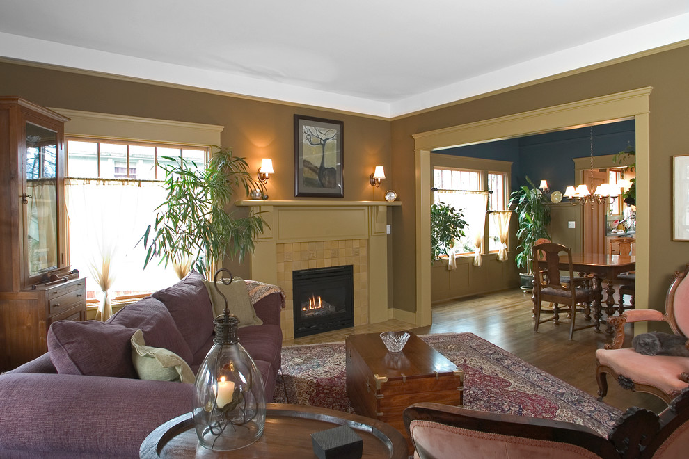 Example of a mid-sized classic formal and enclosed dark wood floor living room design in Seattle with brown walls, a standard fireplace, a tile fireplace and no tv