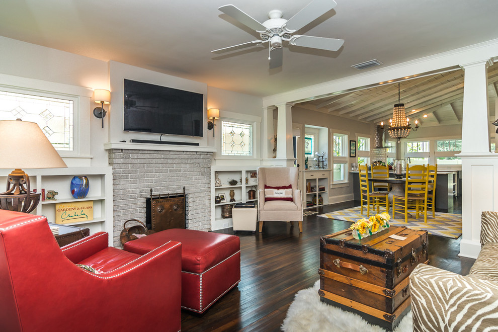 Living room - traditional dark wood floor living room idea in Tampa with white walls, a standard fireplace and a brick fireplace