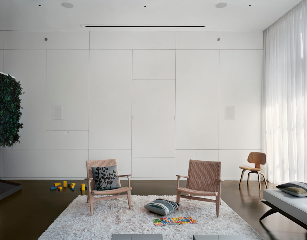 Example of a large minimalist open concept concrete floor living room design in New York with white walls