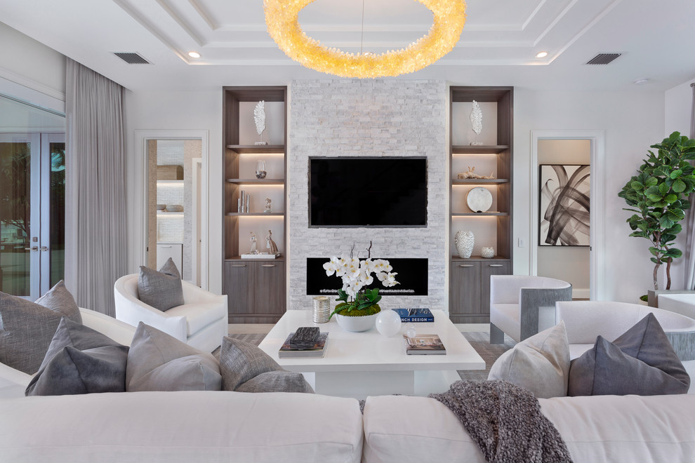 Inspiration for a large contemporary open concept white floor living room remodel in Other with white walls, a ribbon fireplace, a stone fireplace and a wall-mounted tv