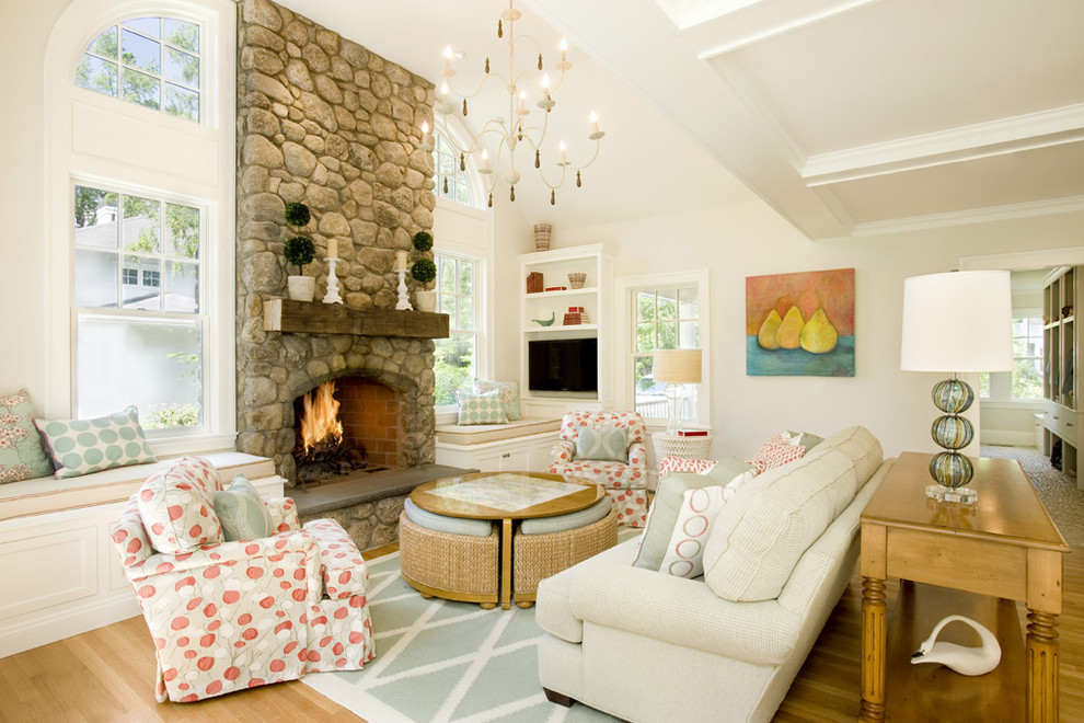 Living room - large traditional open concept medium tone wood floor living room idea in Boston with a stone fireplace, beige walls, a standard fireplace and a media wall