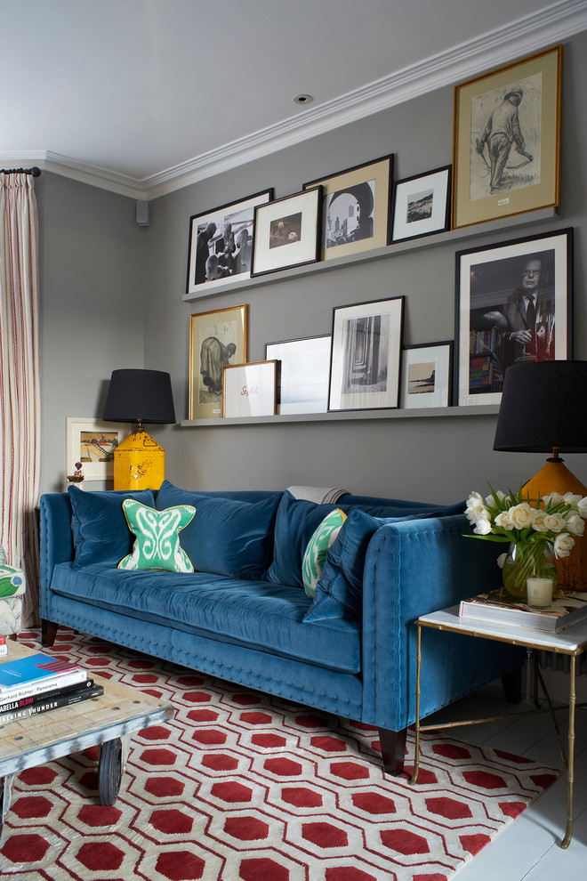 Inspiration for a transitional painted wood floor living room remodel in London with gray walls