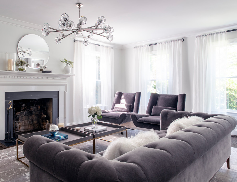 Foto di un soggiorno minimal con sala formale, pareti grigie e camino classico