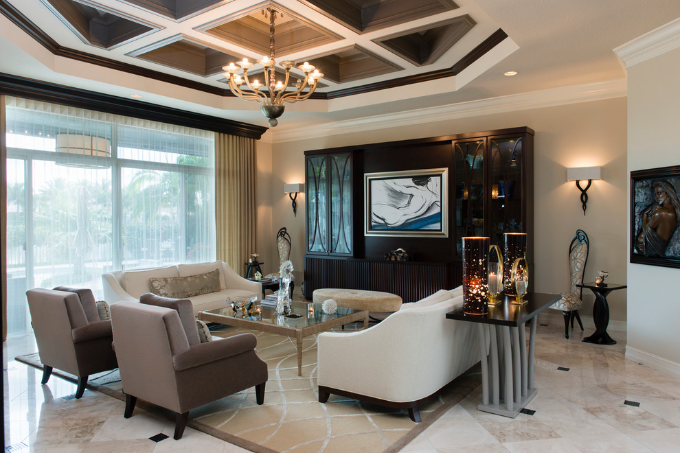This is an example of a large classic open plan living room in Miami with beige walls and marble flooring.