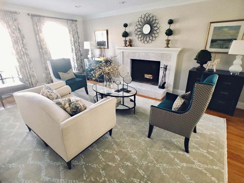 This is an example of a traditional grey and teal living room in DC Metro.