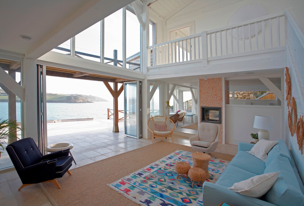 Photo of a large beach style living room in Devon with white walls and ceramic flooring.
