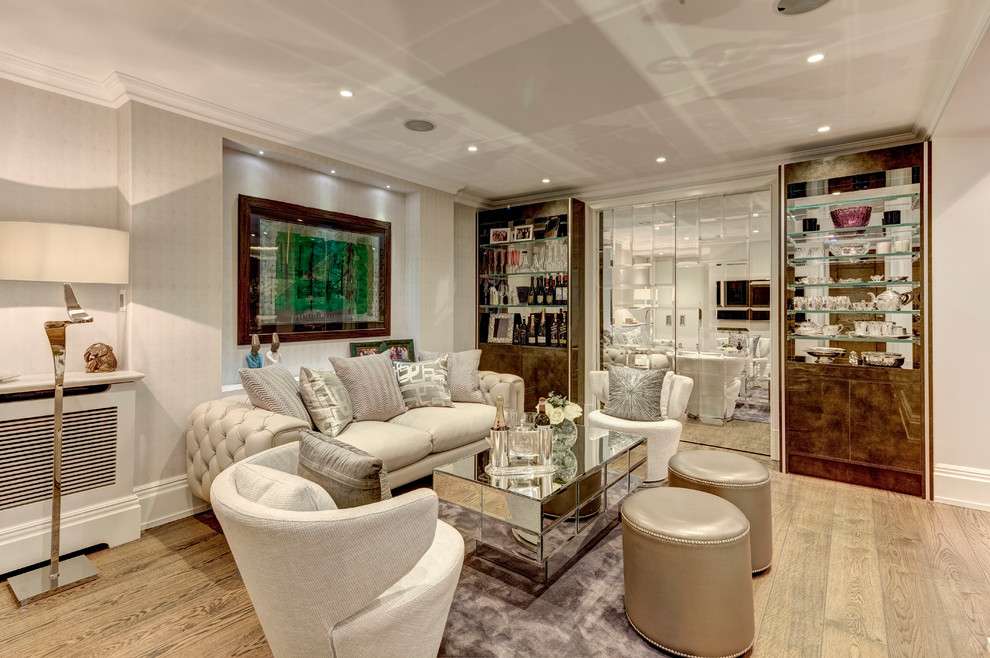 Photo of a large world-inspired formal enclosed living room in London with beige walls and medium hardwood flooring.