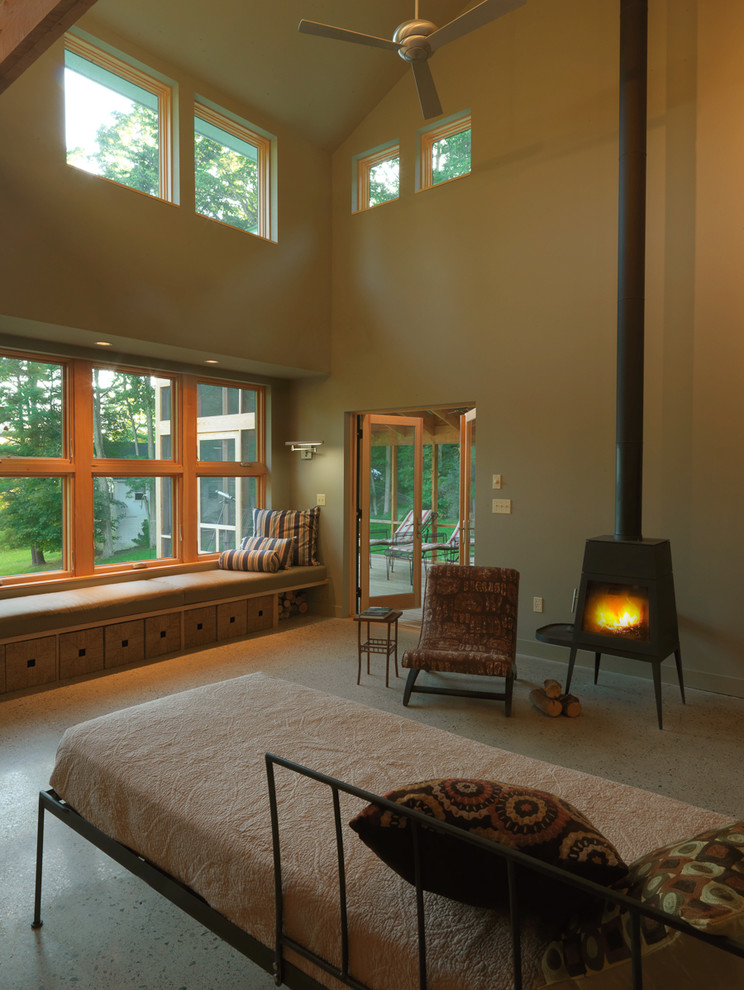 Photo of a traditional living room in Burlington with beige walls and a wood burning stove.