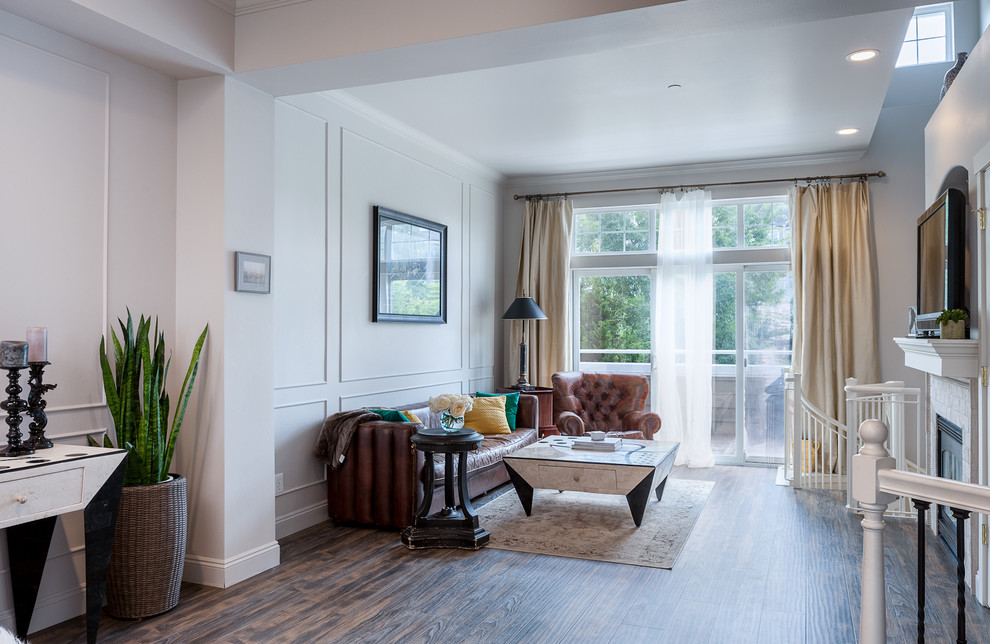 На фото: открытая, парадная гостиная комната среднего размера в стиле неоклассика (современная классика) с серыми стенами, светлым паркетным полом, стандартным камином и фасадом камина из камня без телевизора