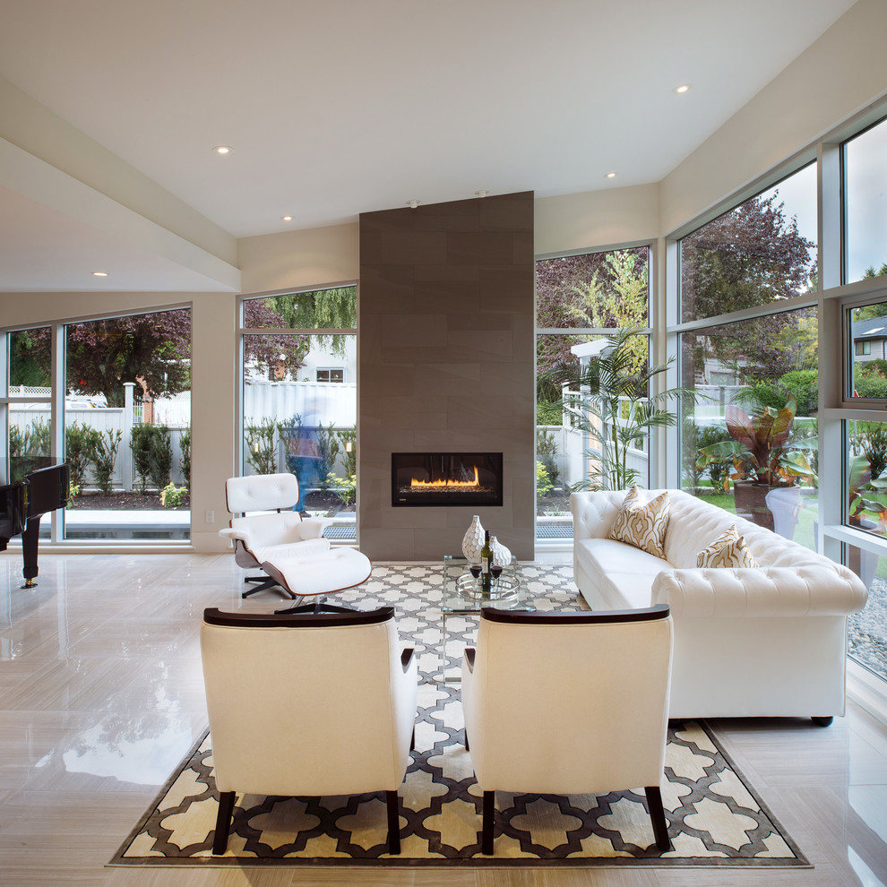 Inspiration for a large modern open concept porcelain tile living room remodel in Vancouver with white walls, a standard fireplace, a tile fireplace and no tv