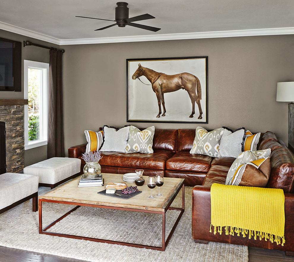 Living room - large transitional open concept dark wood floor living room idea in San Francisco with gray walls, a standard fireplace, a stone fireplace and a wall-mounted tv