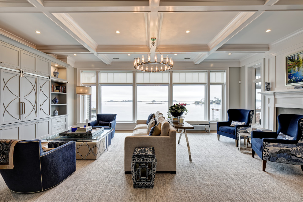 Design ideas for a large nautical formal open plan living room in New York with grey walls, light hardwood flooring, a wooden fireplace surround, a built-in media unit, grey floors, a coffered ceiling and a two-sided fireplace.