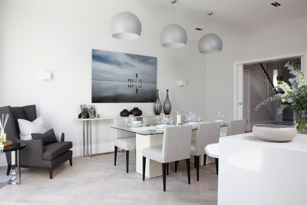 Mid-sized trendy light wood floor dining room photo in London with white walls and no fireplace