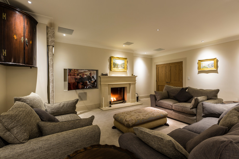 Inspiration for a medium sized classic enclosed living room in Surrey with white walls, carpet, a two-sided fireplace, a stone fireplace surround and a wall mounted tv.