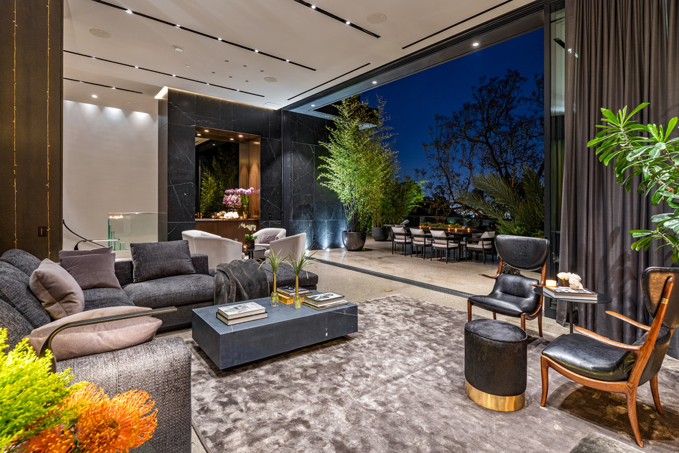 Large minimalist open concept beige floor living room photo in Los Angeles with black walls