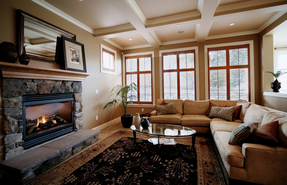 Design ideas for a large classic open plan living room in Seattle with a standard fireplace, a stone fireplace surround, beige walls, carpet and no tv.