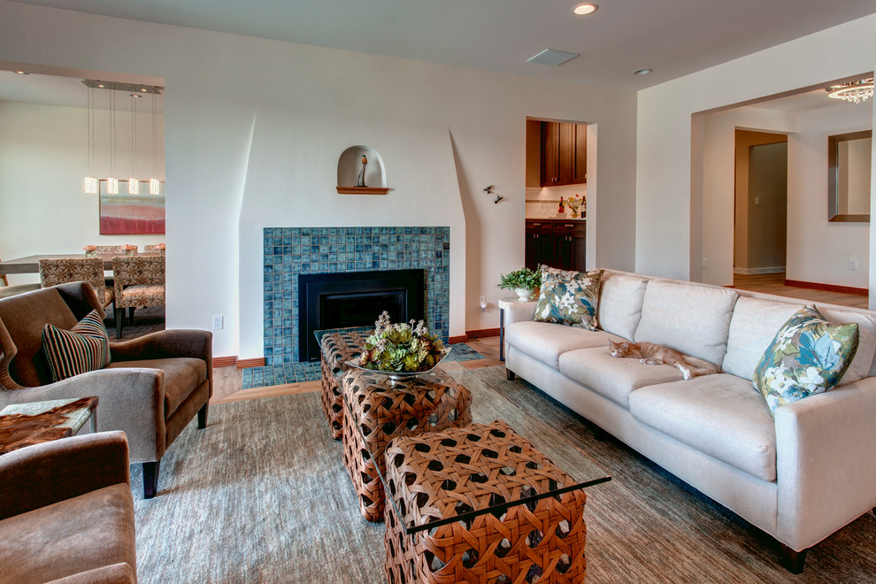 Medium sized classic open plan living room in Seattle with beige walls, light hardwood flooring, a standard fireplace, a tiled fireplace surround and no tv.