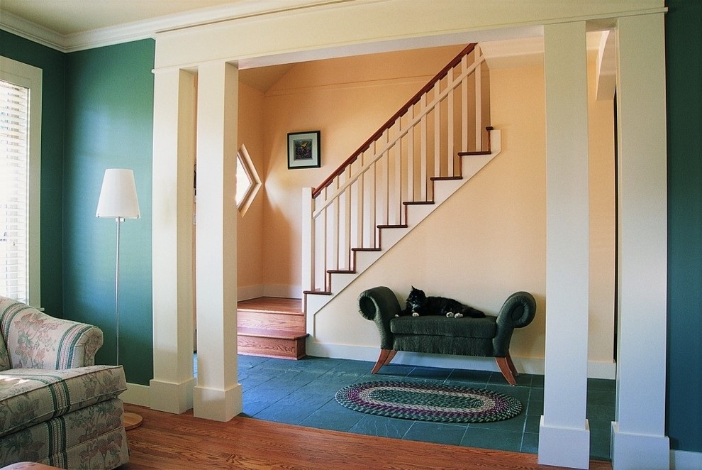 Inspiration for a transitional medium tone wood floor and brown floor living room remodel in Toronto with green walls