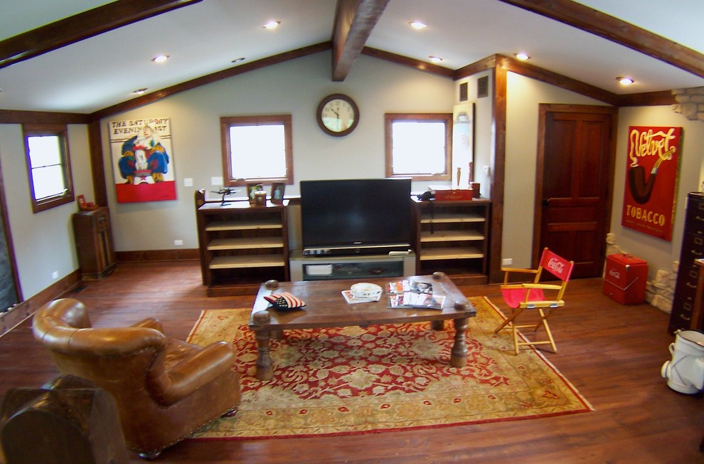 Example of a mid-sized classic enclosed dark wood floor living room design in Chicago with green walls and no fireplace