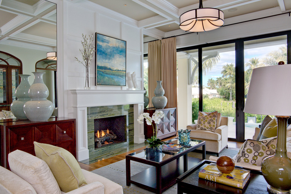 Inspiration for a contemporary formal living room remodel in Orlando with white walls and a standard fireplace