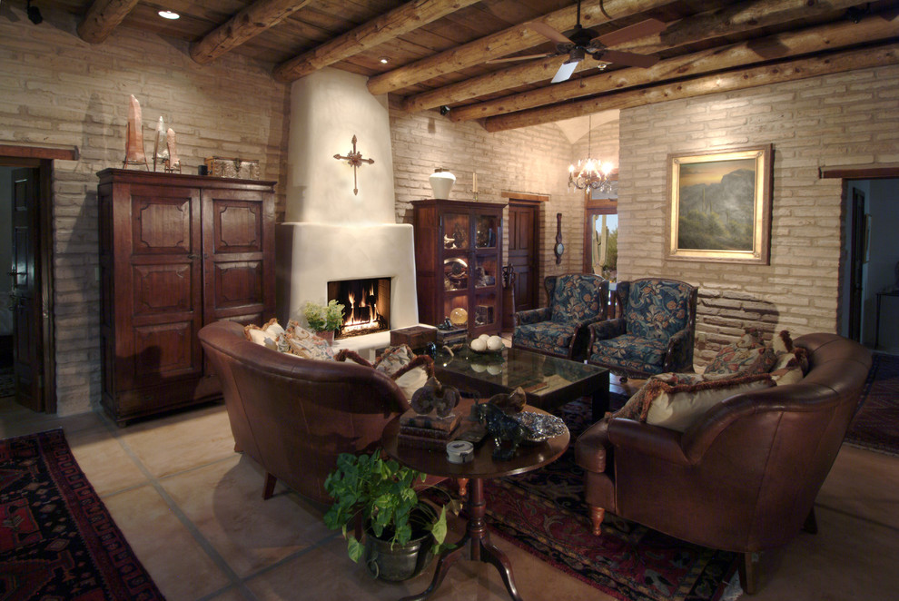 This is an example of a medium sized rustic formal open plan living room in Phoenix with concrete flooring, grey walls, a standard fireplace, a concrete fireplace surround, no tv and beige floors.