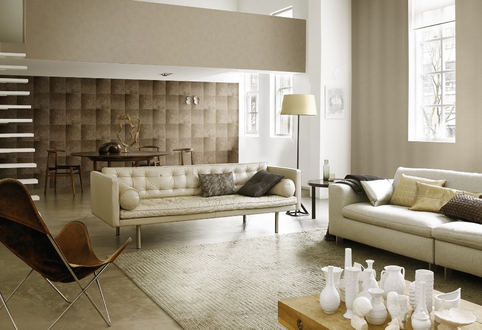 Example of a mid-sized trendy formal and open concept concrete floor living room design in New York with beige walls