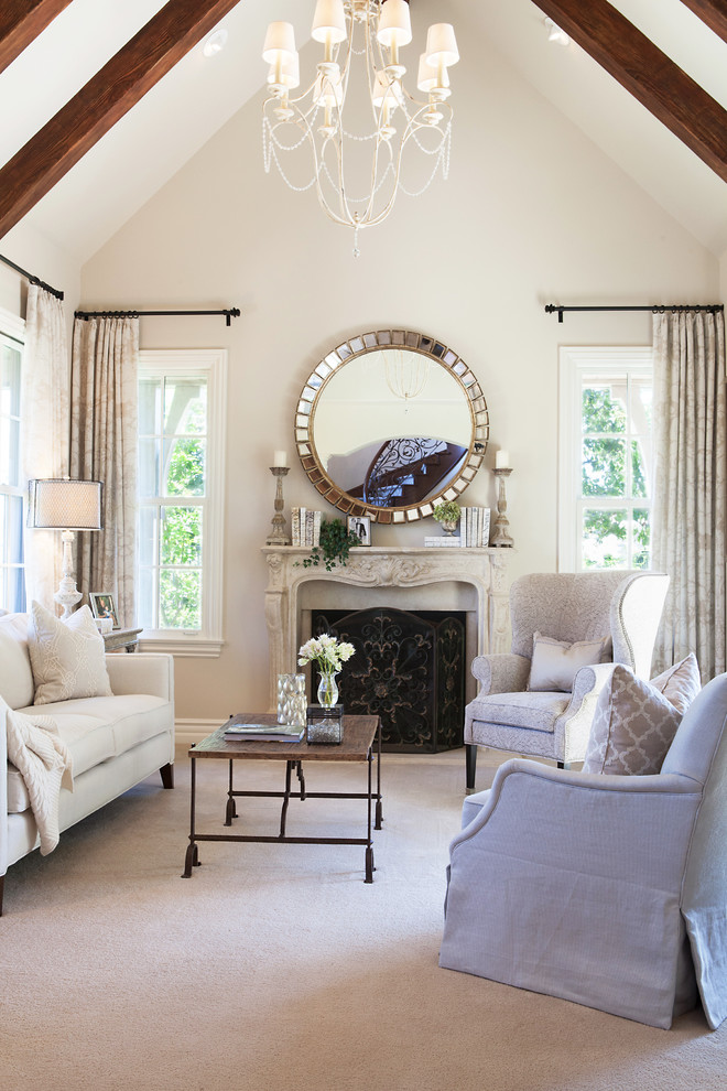 Large transitional formal and enclosed carpeted and beige floor living room photo in Orange County with beige walls, a standard fireplace, a stone fireplace and no tv