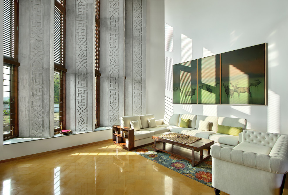 World-inspired living room in Ahmedabad with white walls.