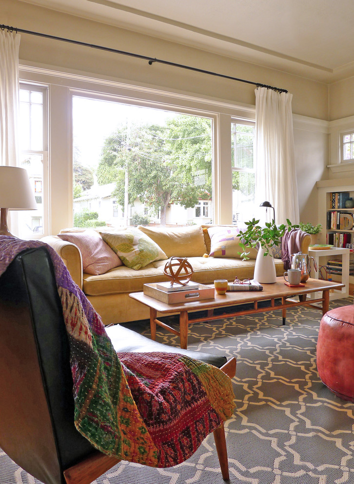 Photo of a bohemian living room in San Francisco with grey walls and medium hardwood flooring.
