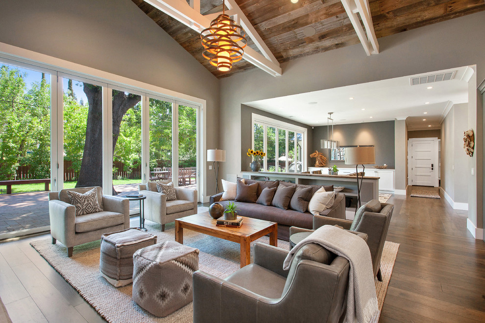 Living room - mid-sized country open concept medium tone wood floor living room idea in San Francisco with gray walls