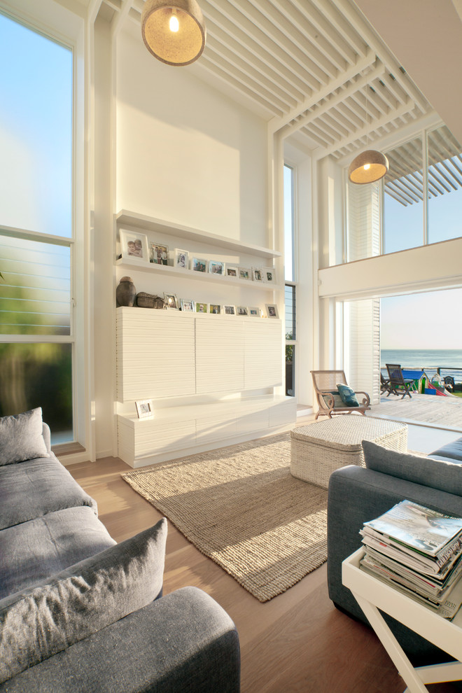 This is an example of a large contemporary open plan living room in Gold Coast - Tweed with white walls.