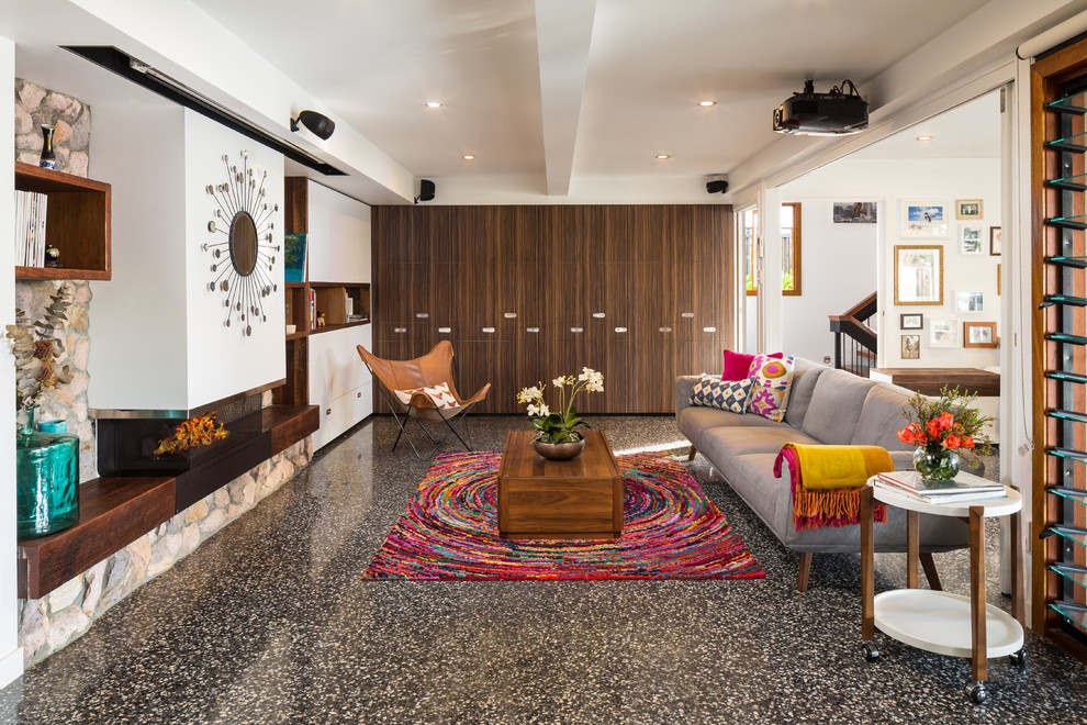 Example of a mid-century modern open concept living room design in Brisbane with white walls
