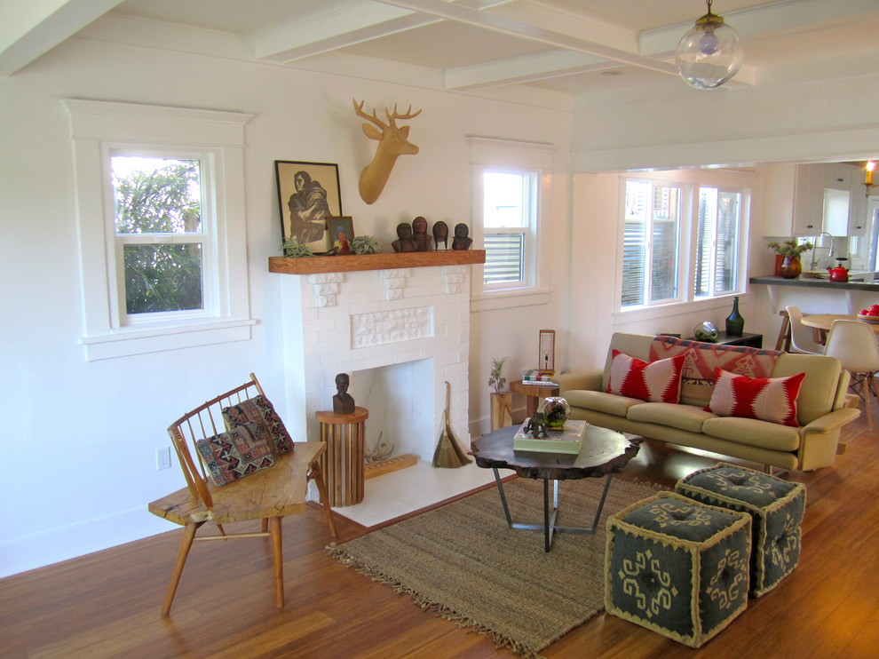 Design ideas for an eclectic living room in Los Angeles with a brick fireplace surround.