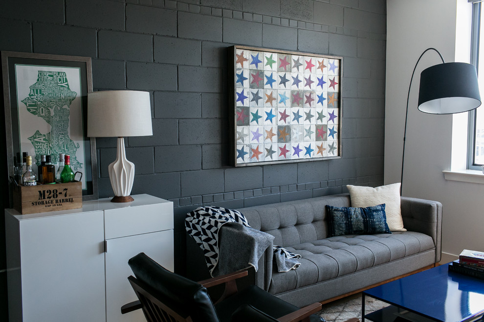 Стильный дизайн: открытая, парадная гостиная комната:: освещение в стиле лофт с черными стенами - последний тренд