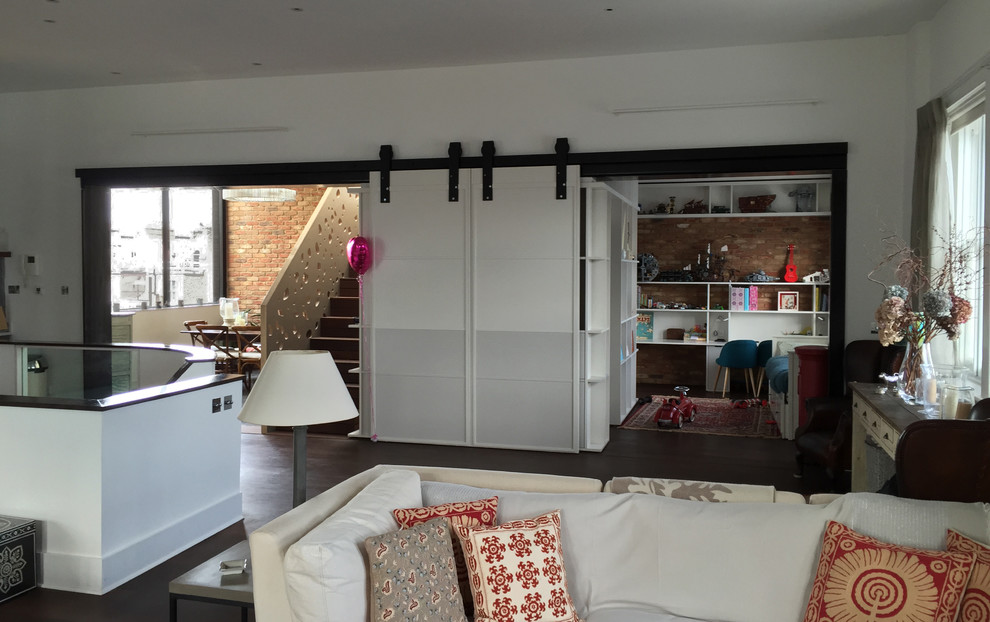Medium sized contemporary open plan living room in London.