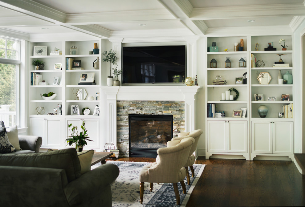 Inspiration for a large transitional open concept dark wood floor living room remodel in New York with white walls, a standard fireplace, a stone fireplace and a wall-mounted tv