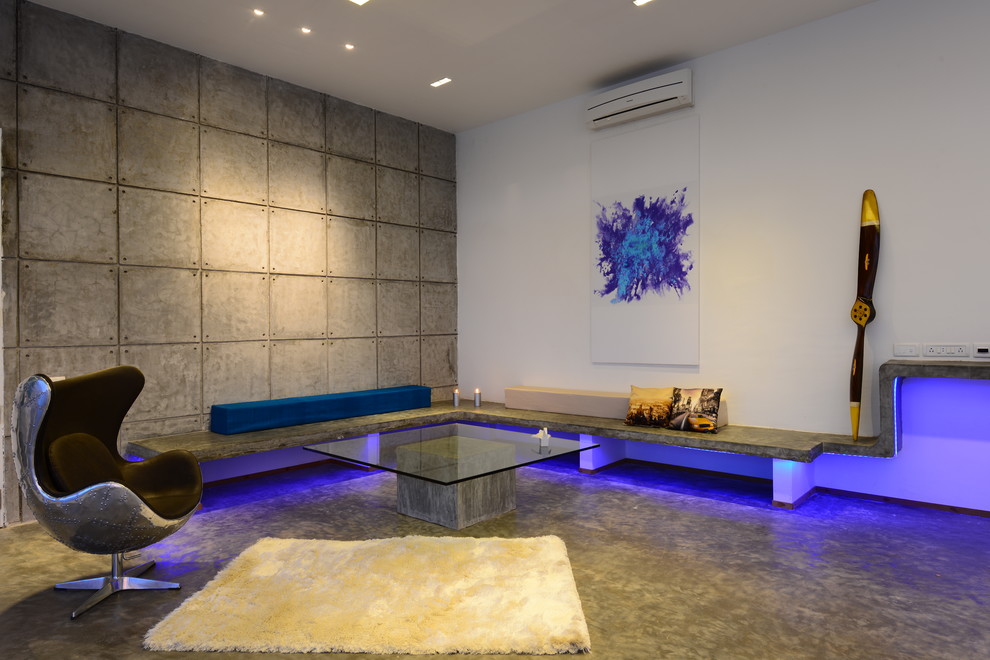 Стильный дизайн: гостиная комната среднего размера в современном стиле с бетонным полом - последний тренд