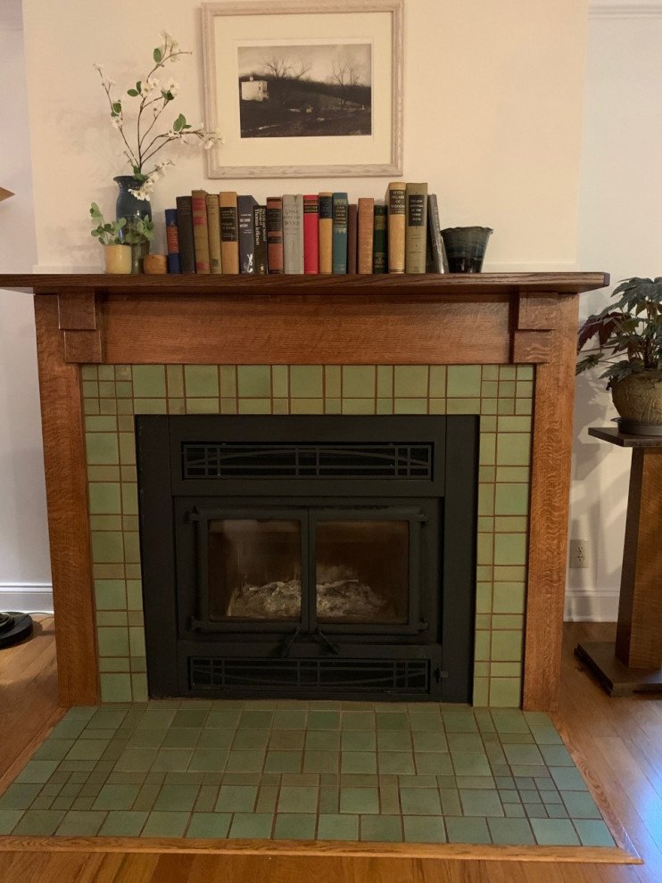 Mid-sized arts and crafts enclosed medium tone wood floor and green floor living room photo in Other with yellow walls, a standard fireplace and a tile fireplace