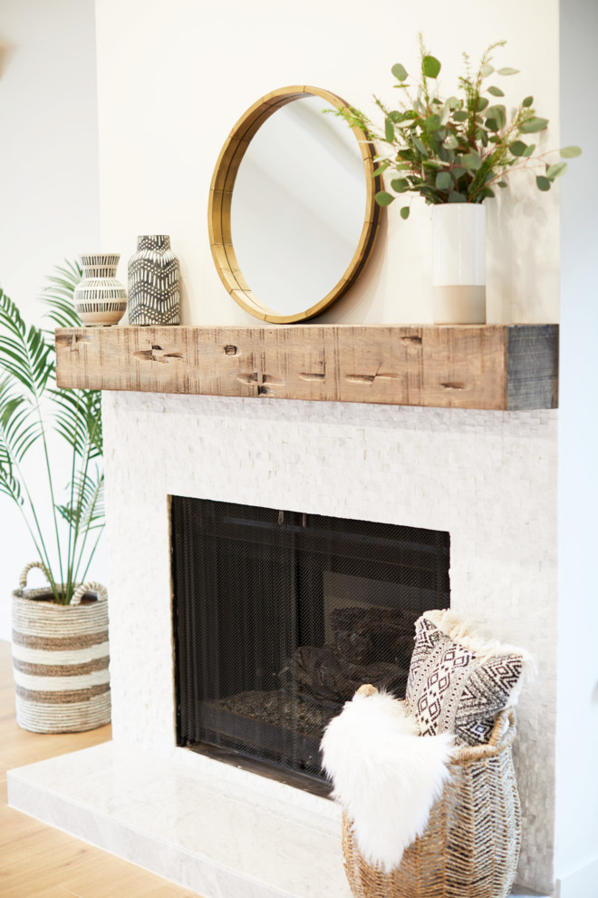 Inspiration for a large country open concept and formal light wood floor and beige floor living room remodel in San Diego with white walls, a standard fireplace and a tile fireplace