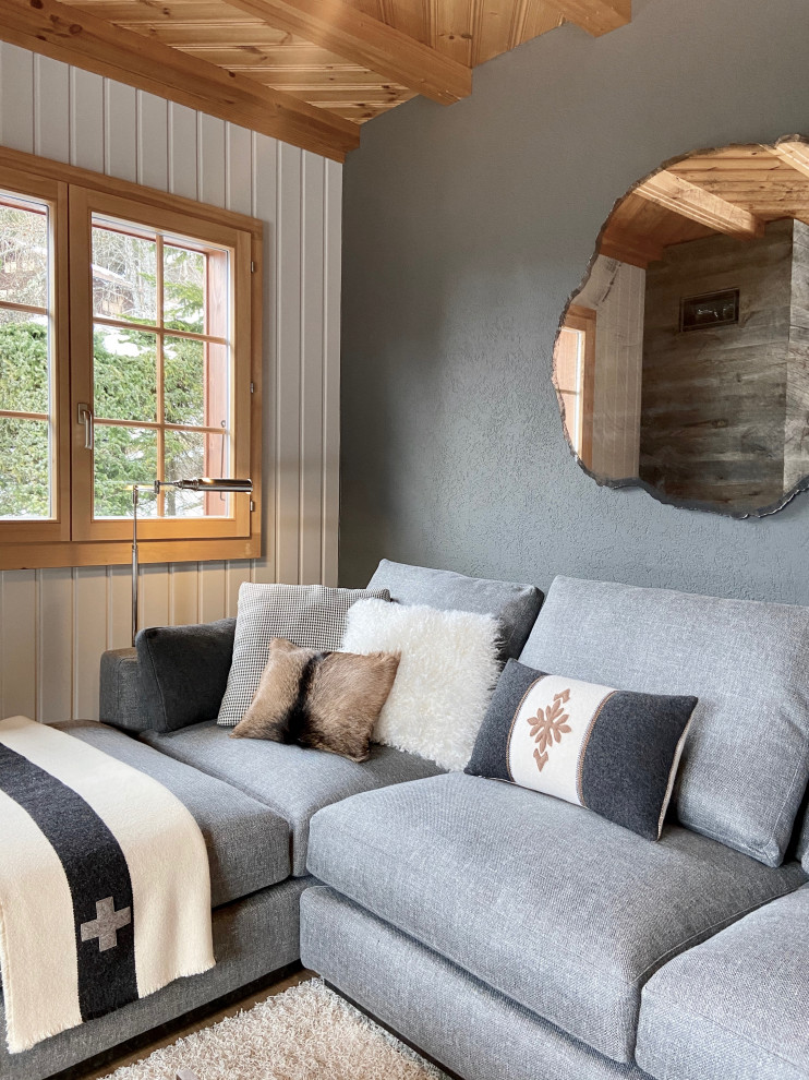 Idée de décoration pour un salon minimaliste avec une cheminée d'angle et un manteau de cheminée en bois.