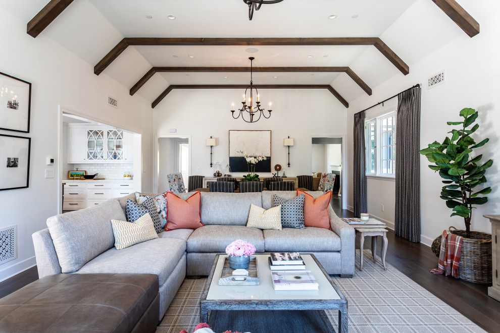 Inspiration for a medium sized farmhouse mezzanine living room in Los Angeles with white walls, dark hardwood flooring, a standard fireplace, a concrete fireplace surround and a wall mounted tv.