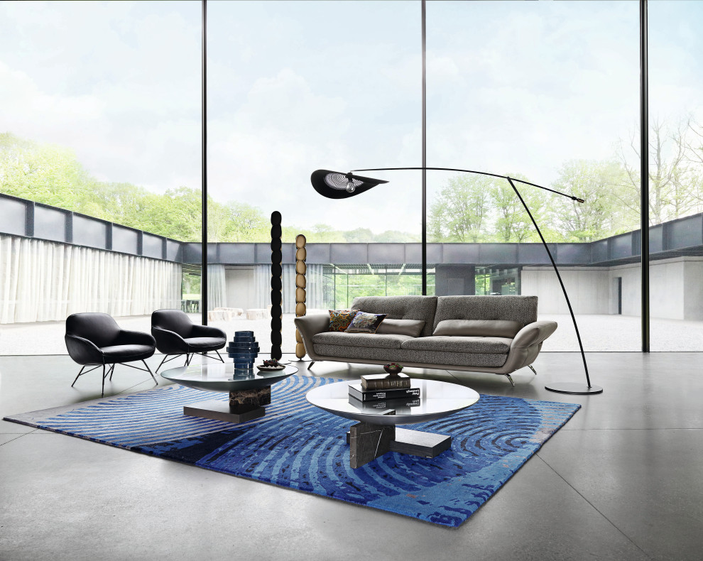 Idee per un grande soggiorno contemporaneo aperto con pavimento in cemento, nessuna TV e pavimento grigio