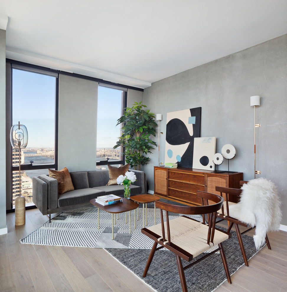 Living room - scandinavian formal light wood floor living room idea in New York with gray walls, no fireplace and no tv