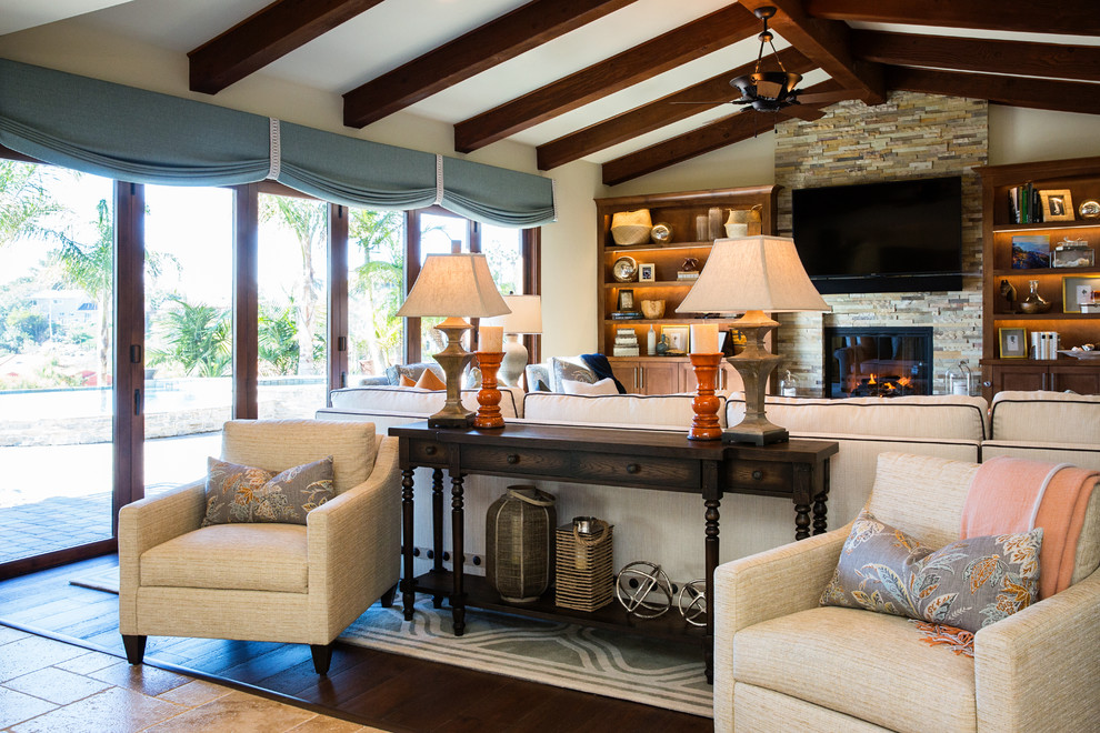 Photo of a large classic open plan living room in San Diego with beige walls, medium hardwood flooring, a standard fireplace, a tiled fireplace surround and a built-in media unit.